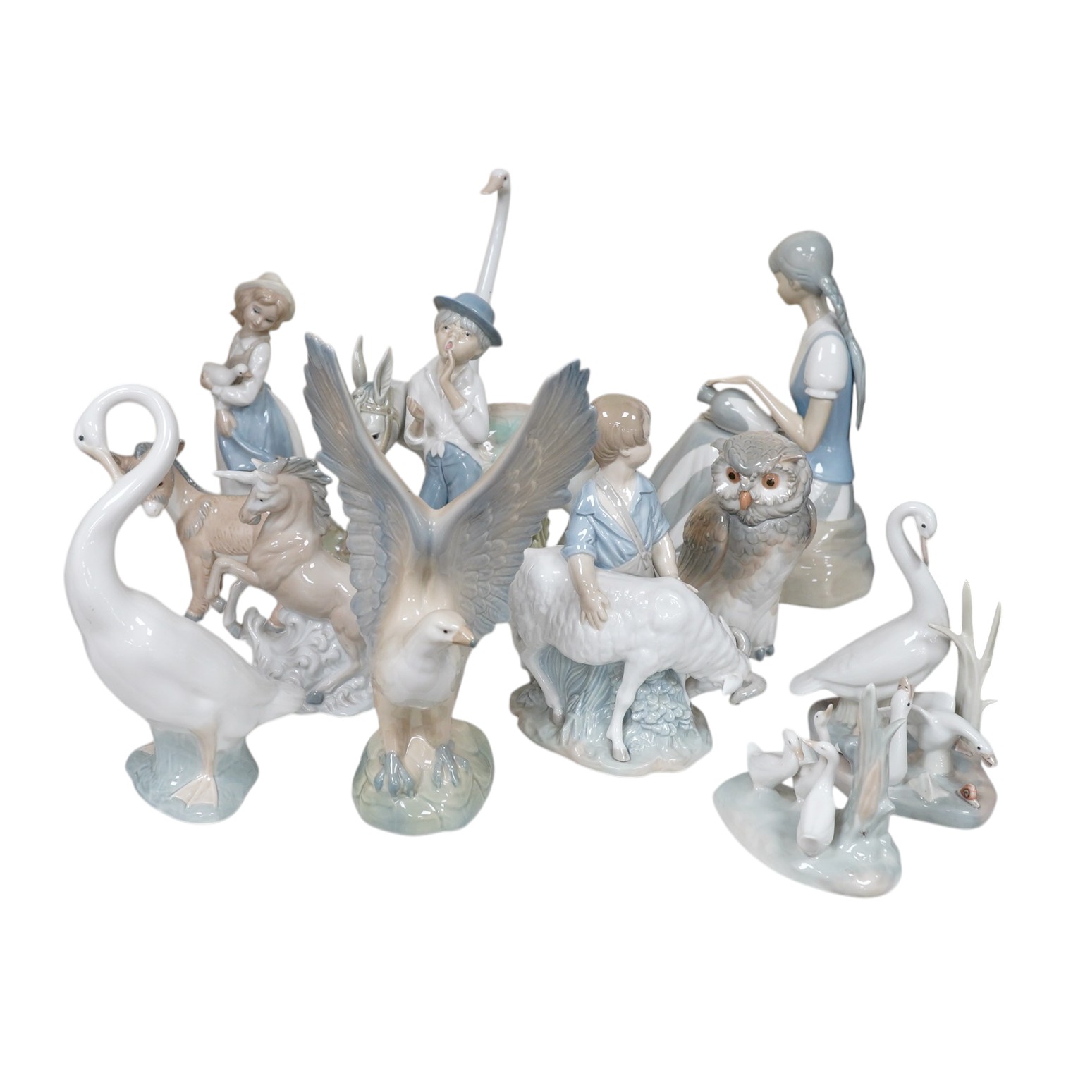 A quantity of Lladro style and Nao figures (12). Condition - good